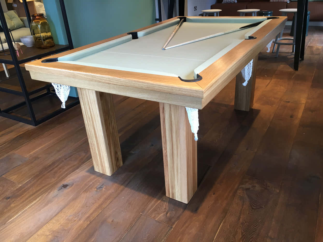 A Pool Table With A Wooden Top And A Pool Cue