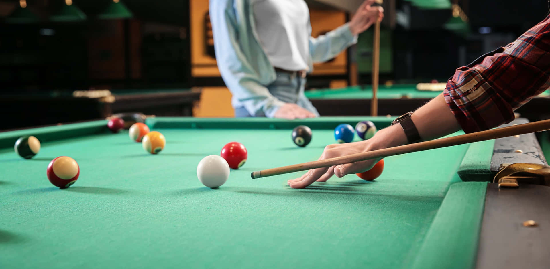 A Person Is Playing Billiards With A Ball