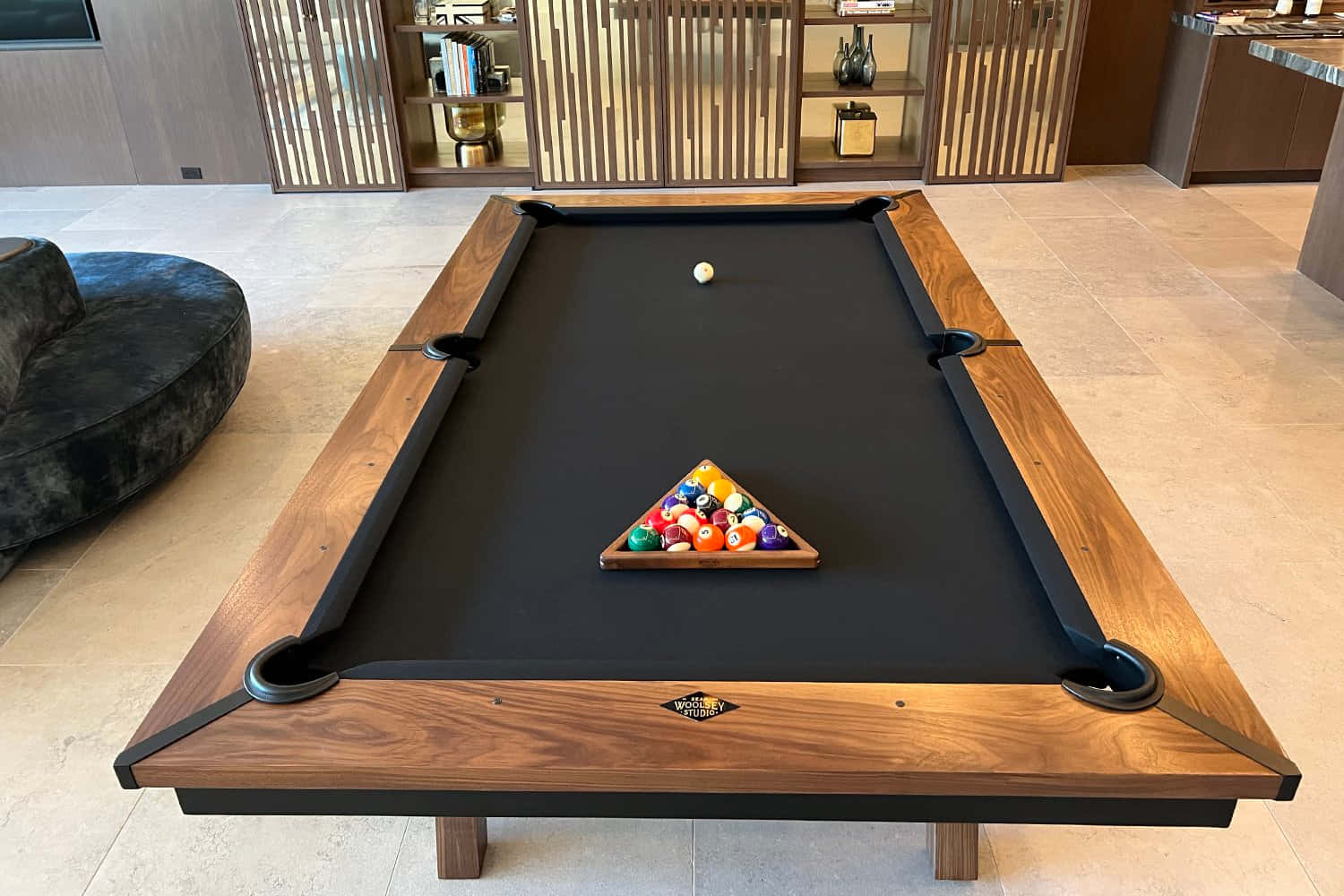A Pool Table With A Black Cloth And A Black Leather Top