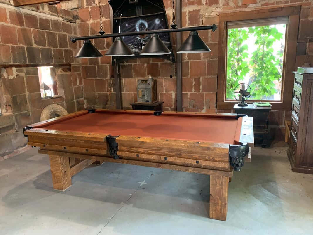 A Pool Table In A Room With A Fireplace