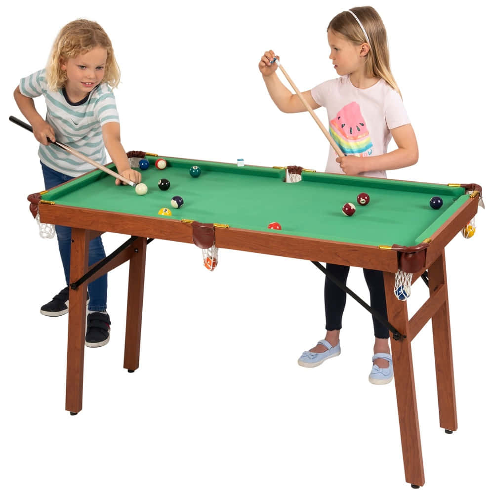 Two Children Playing Pool On A Table