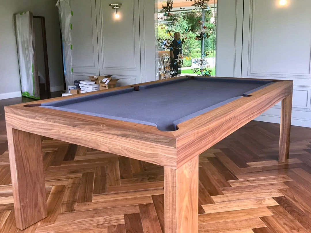 A Pool Table With A Blue Cloth On It