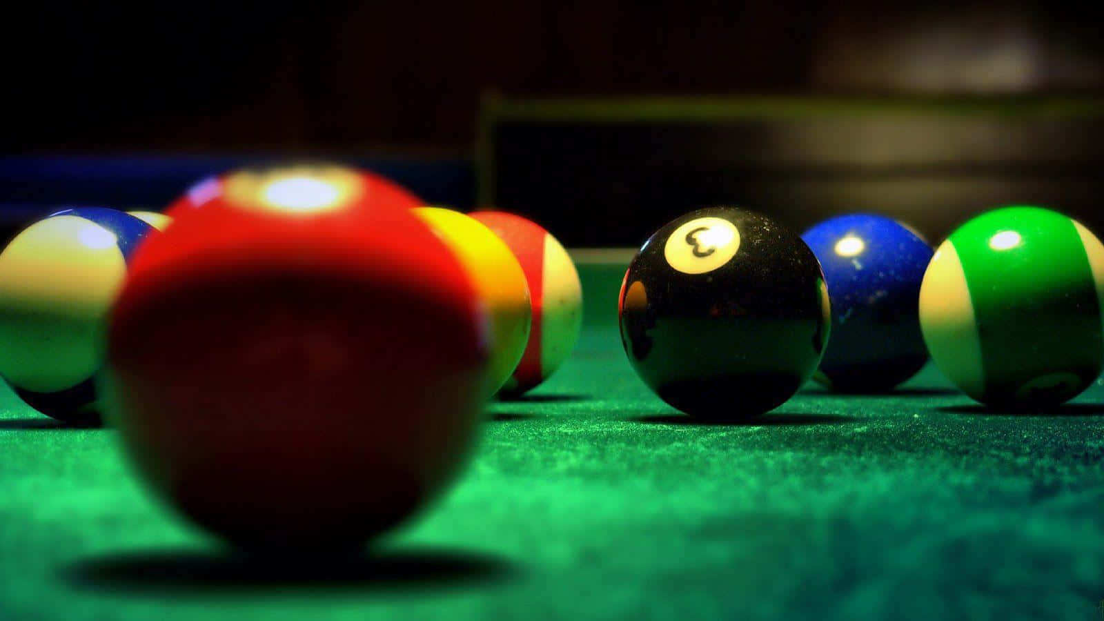 A Closer Look at Pool Table with Scattered Balls Wallpaper