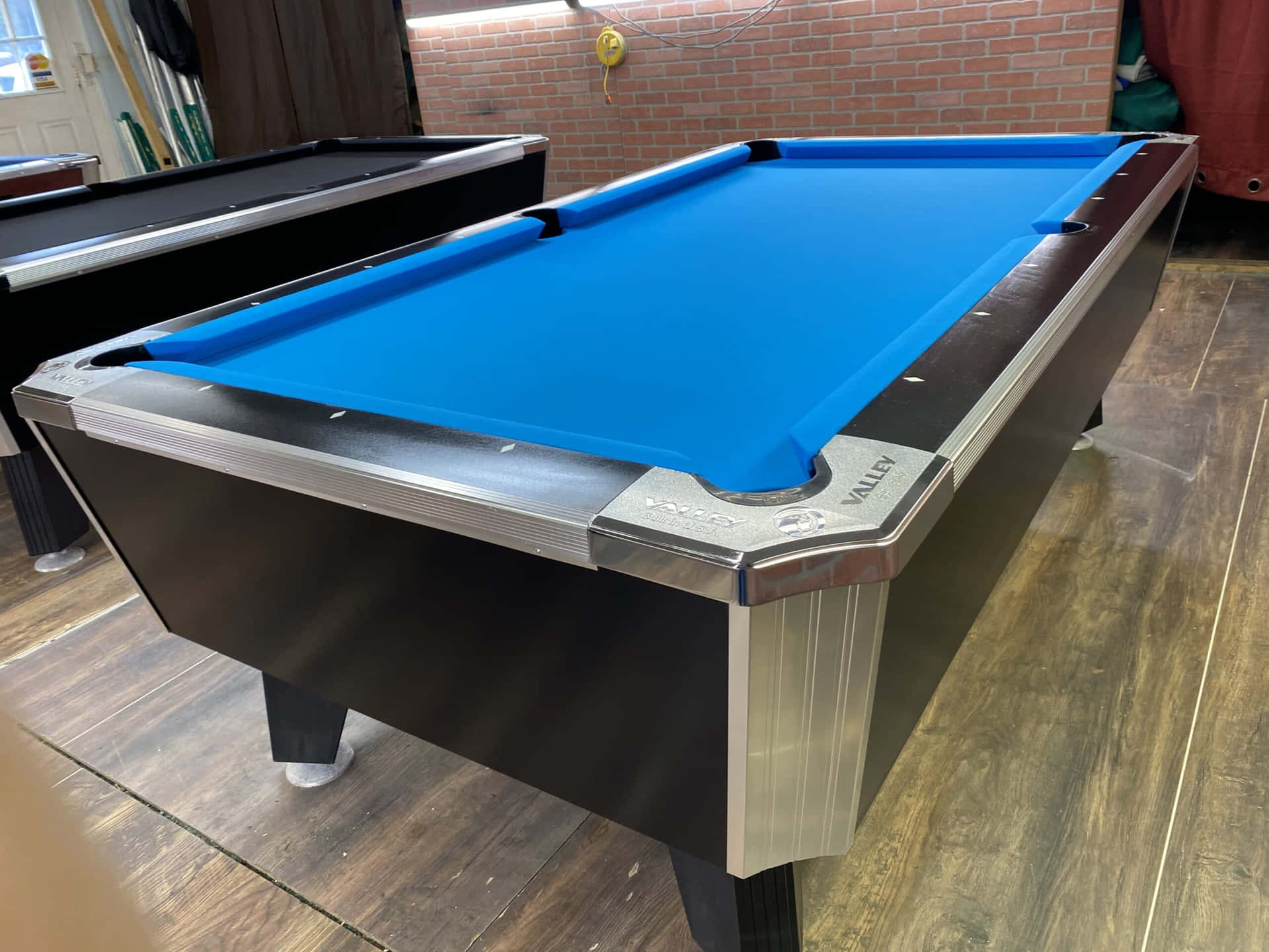 A Pool Table With A Blue Cloth
