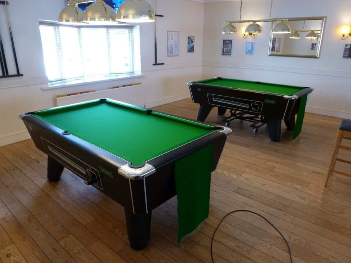 A Pool Table In A Room With A Green Cloth