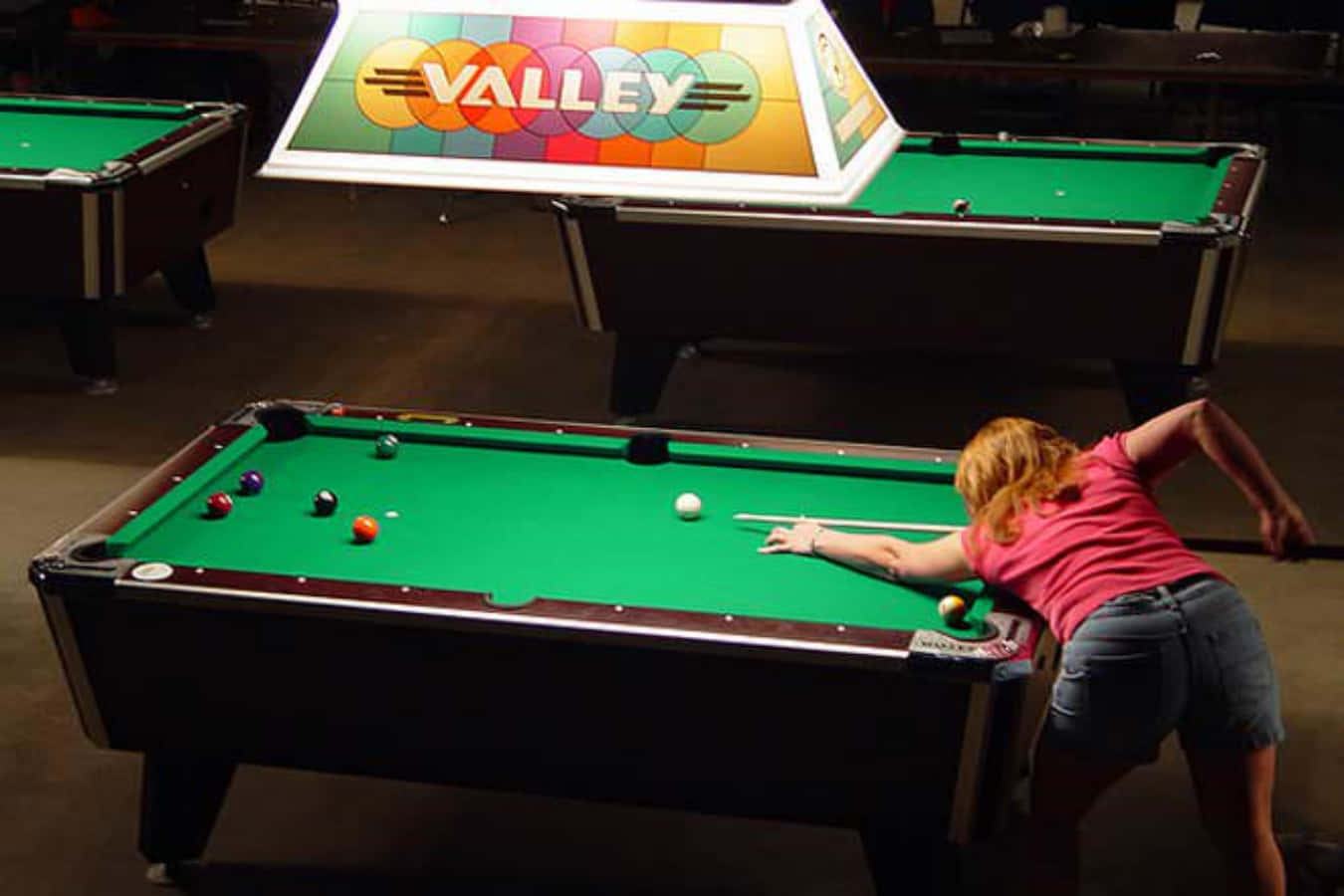A Woman Playing Pool