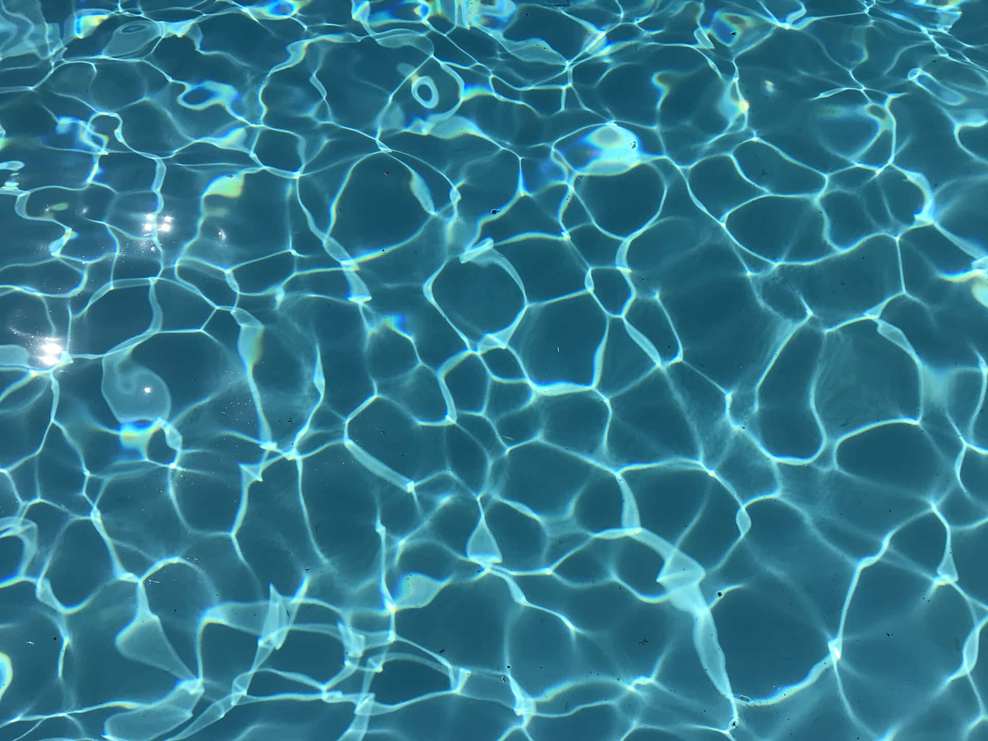A Close Up Of A Pool With Clear Water