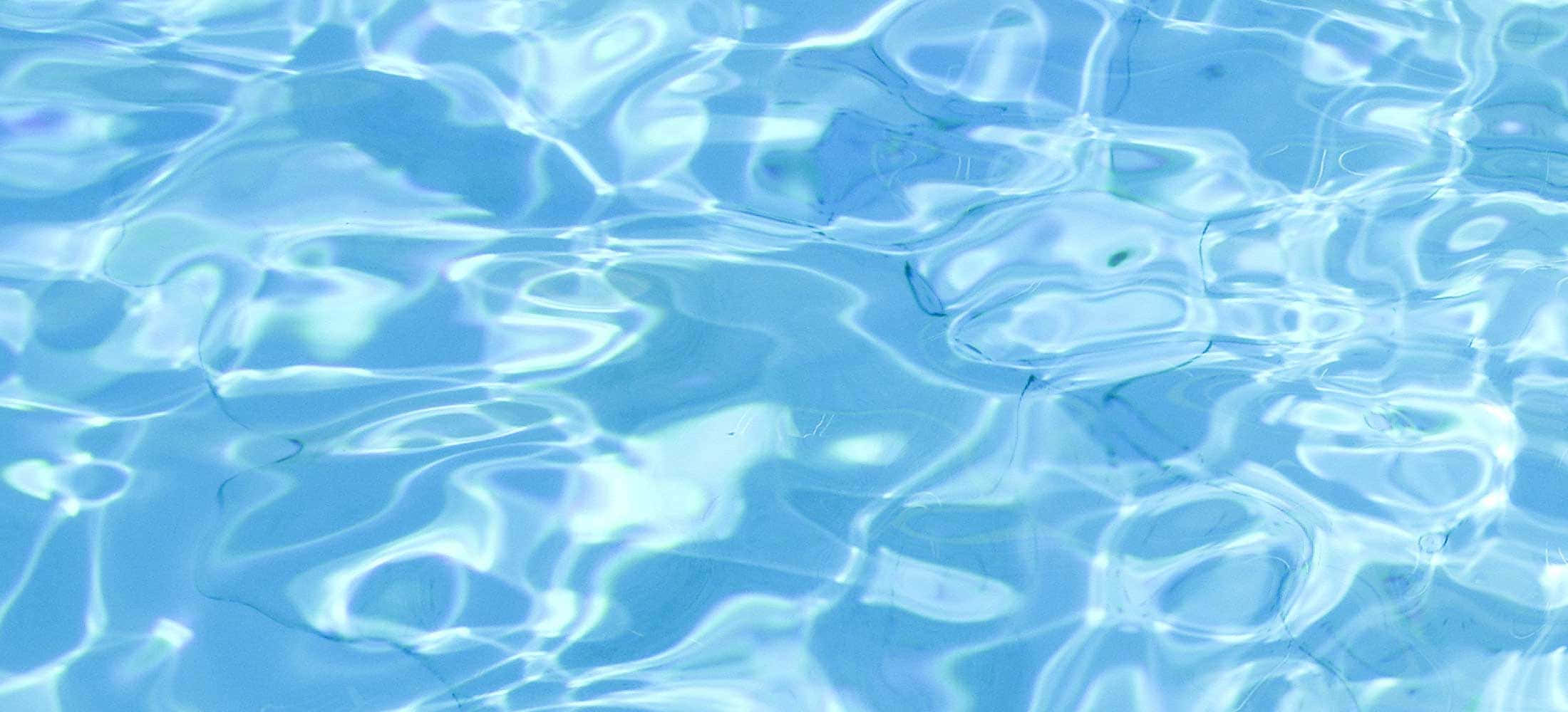 A Close Up Of A Blue Pool With Water Ripples
