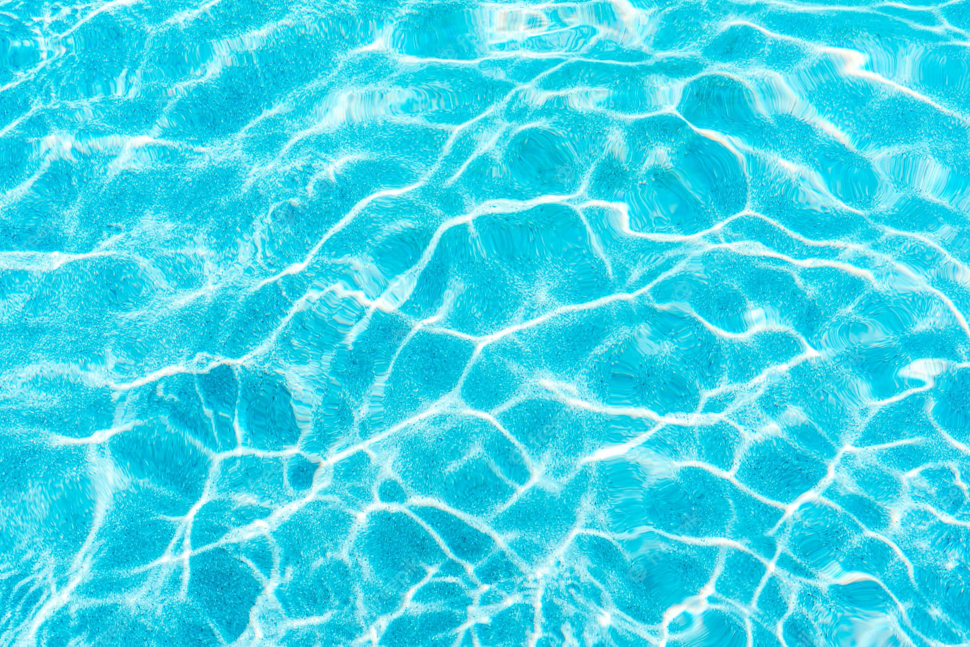 A Blue Pool With Clear Water And A Blue Surface