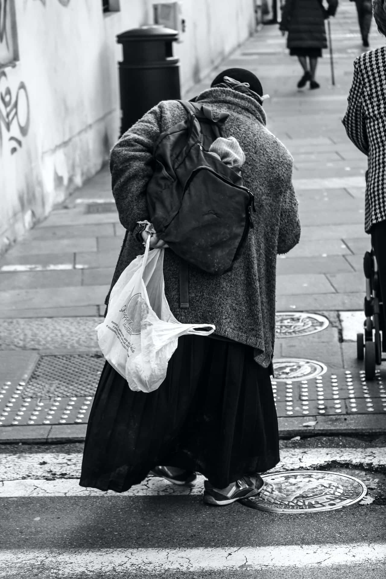 Poor Old Woman Walking Beside The Street Wallpaper
