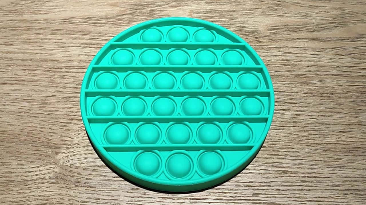 A Green Plastic Mold With A Lot Of Holes