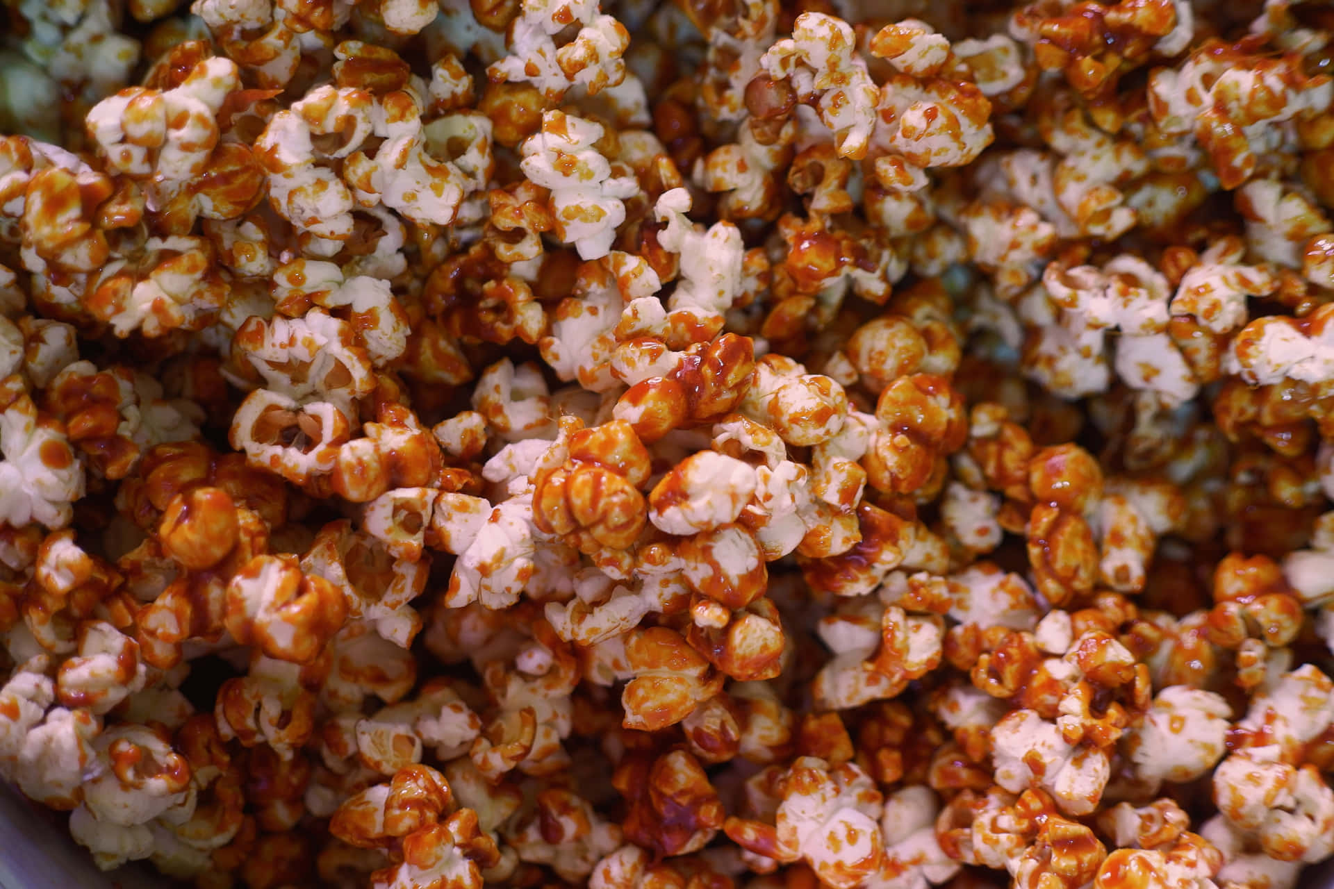 A Bowl Of Popcorn With A Brown Color