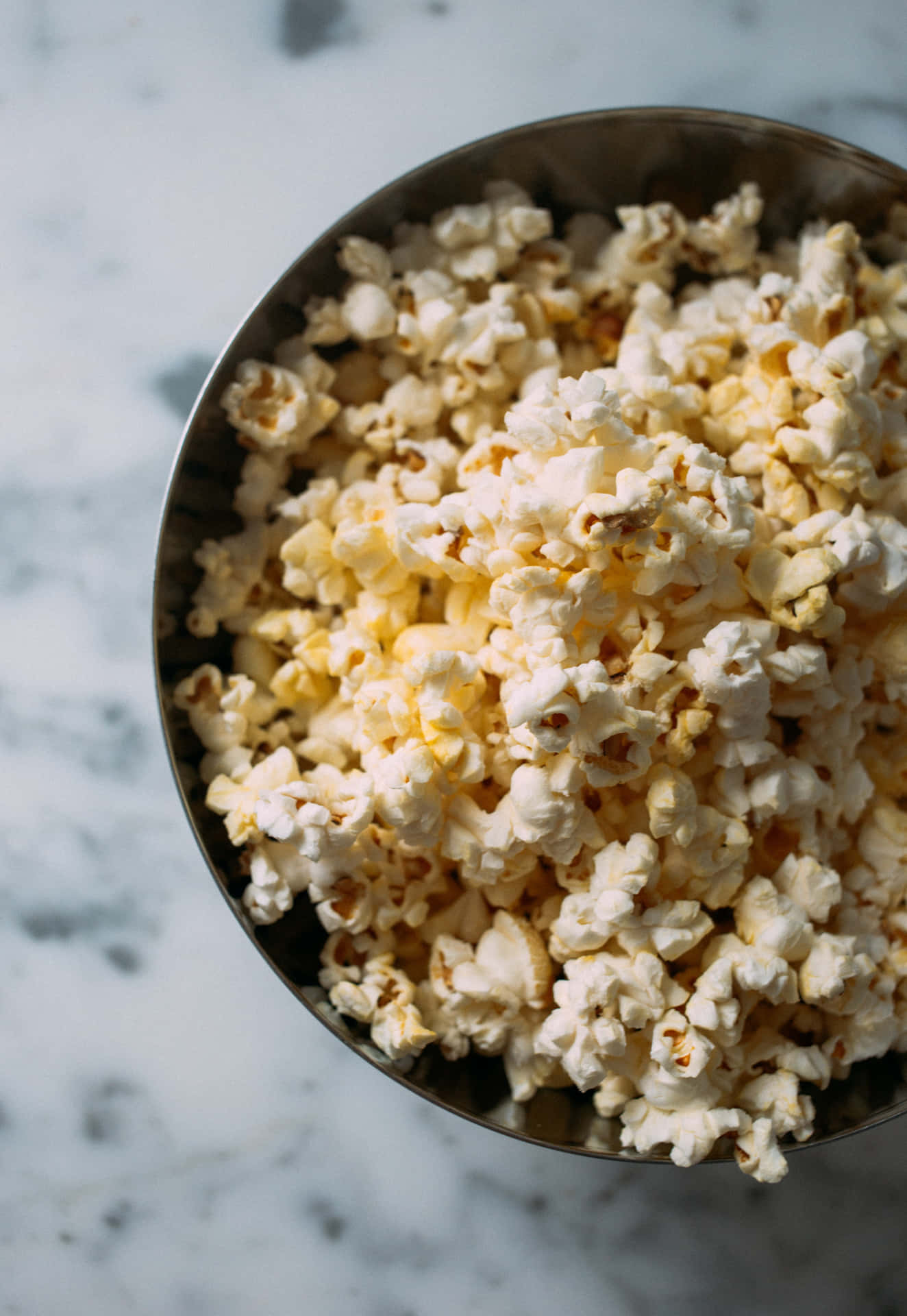 Enjoy a handful of freshly popped popcorn.