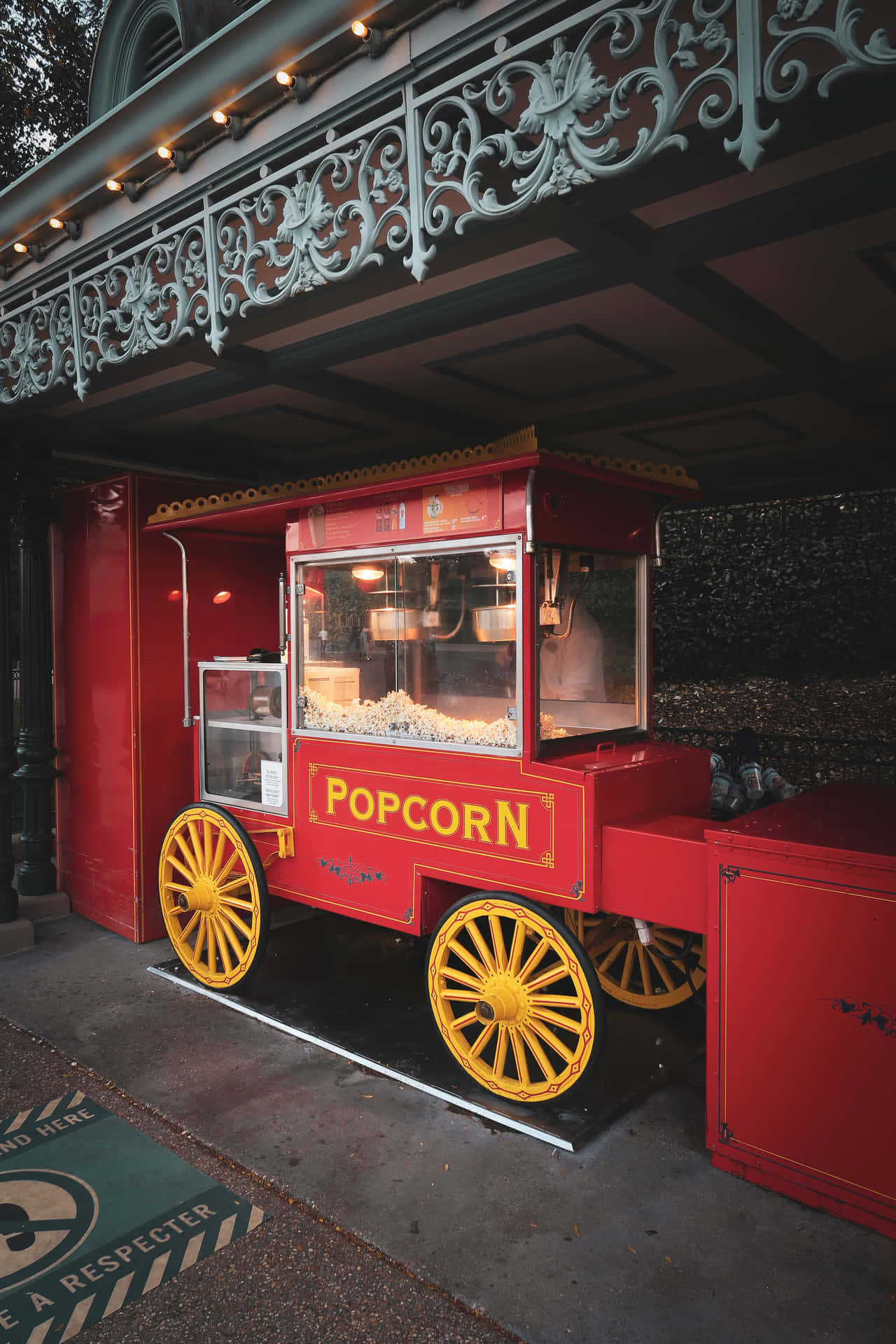 A Red And Yellow Popcorn Cart