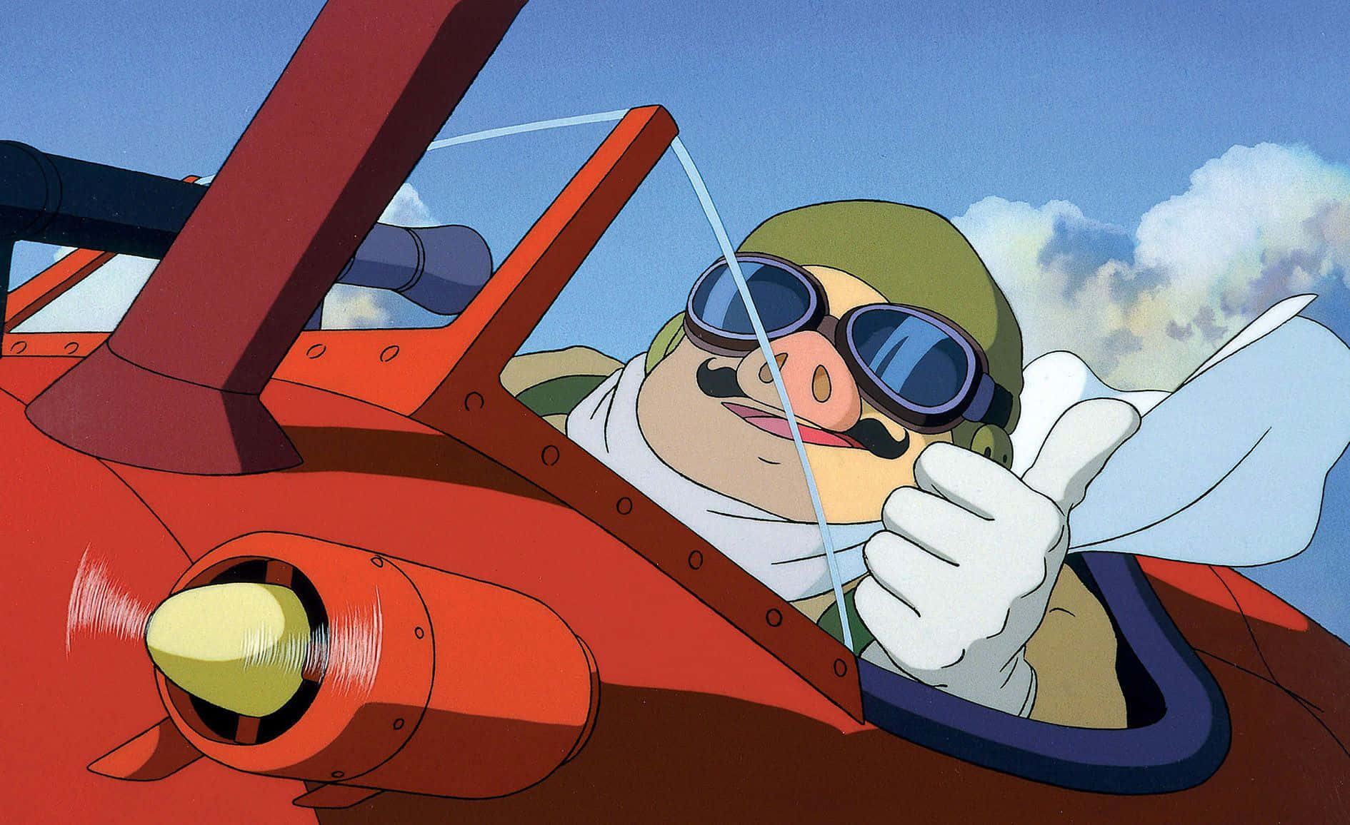 Porco Rosso flying high in his red seaplane Wallpaper