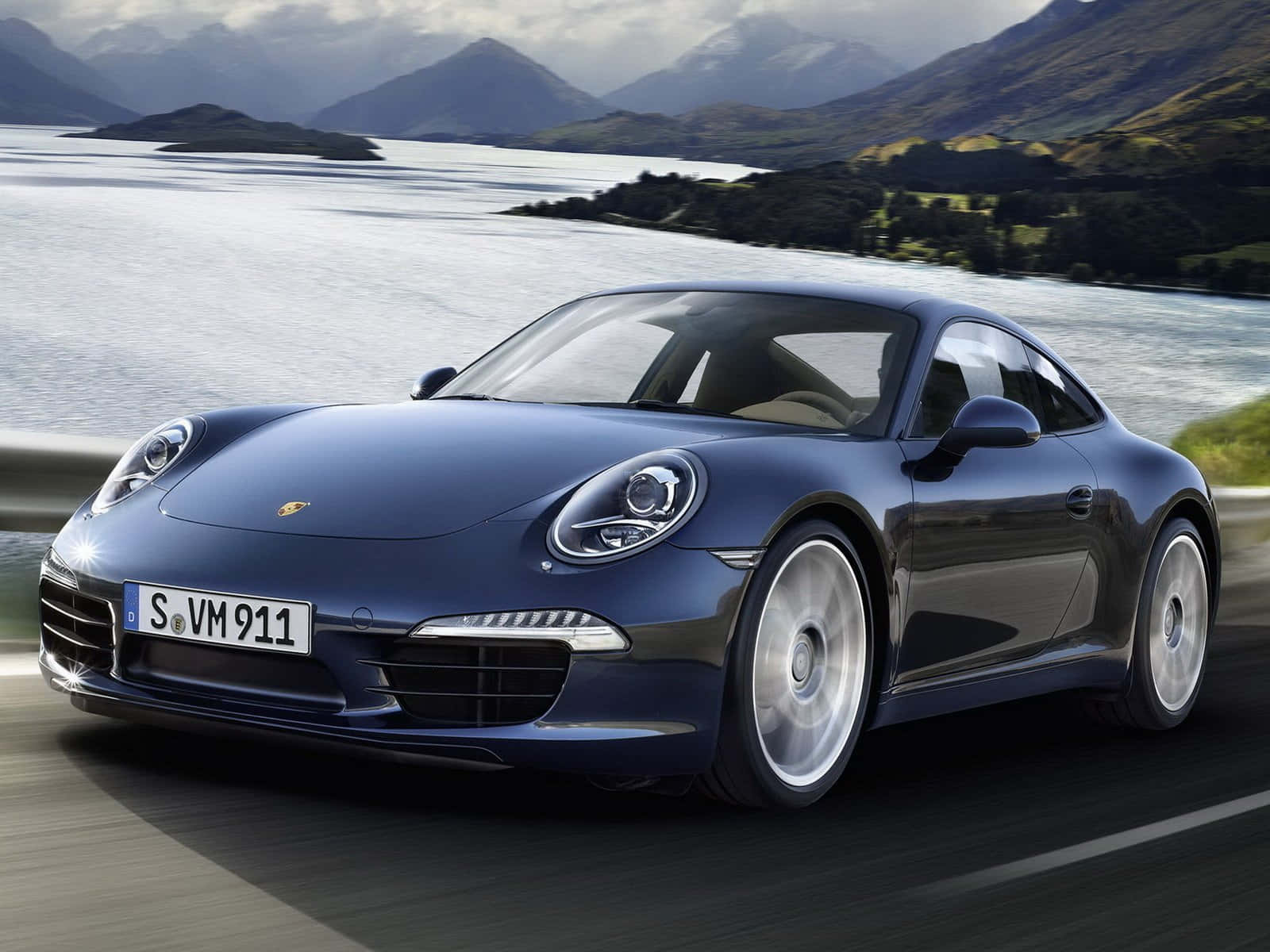 Sleek Red Porsche Amidst Lush Green Scenery