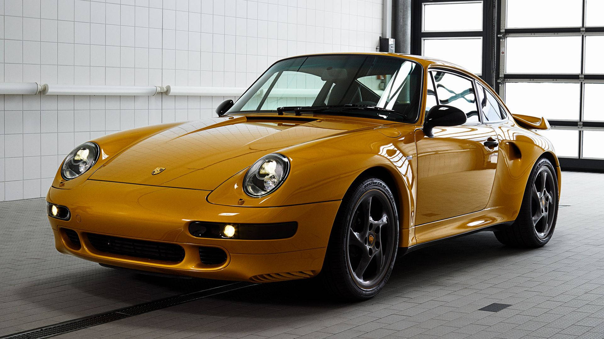 Porsche 911 In Gold Glossy Finish Wallpaper