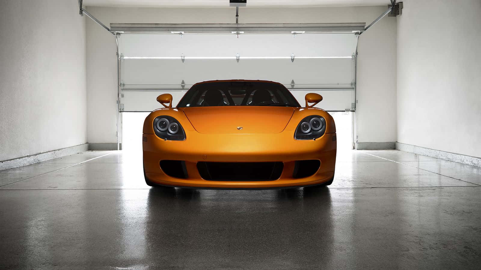 Porsche Carrera Gt Driving On An Open Highway Wallpaper