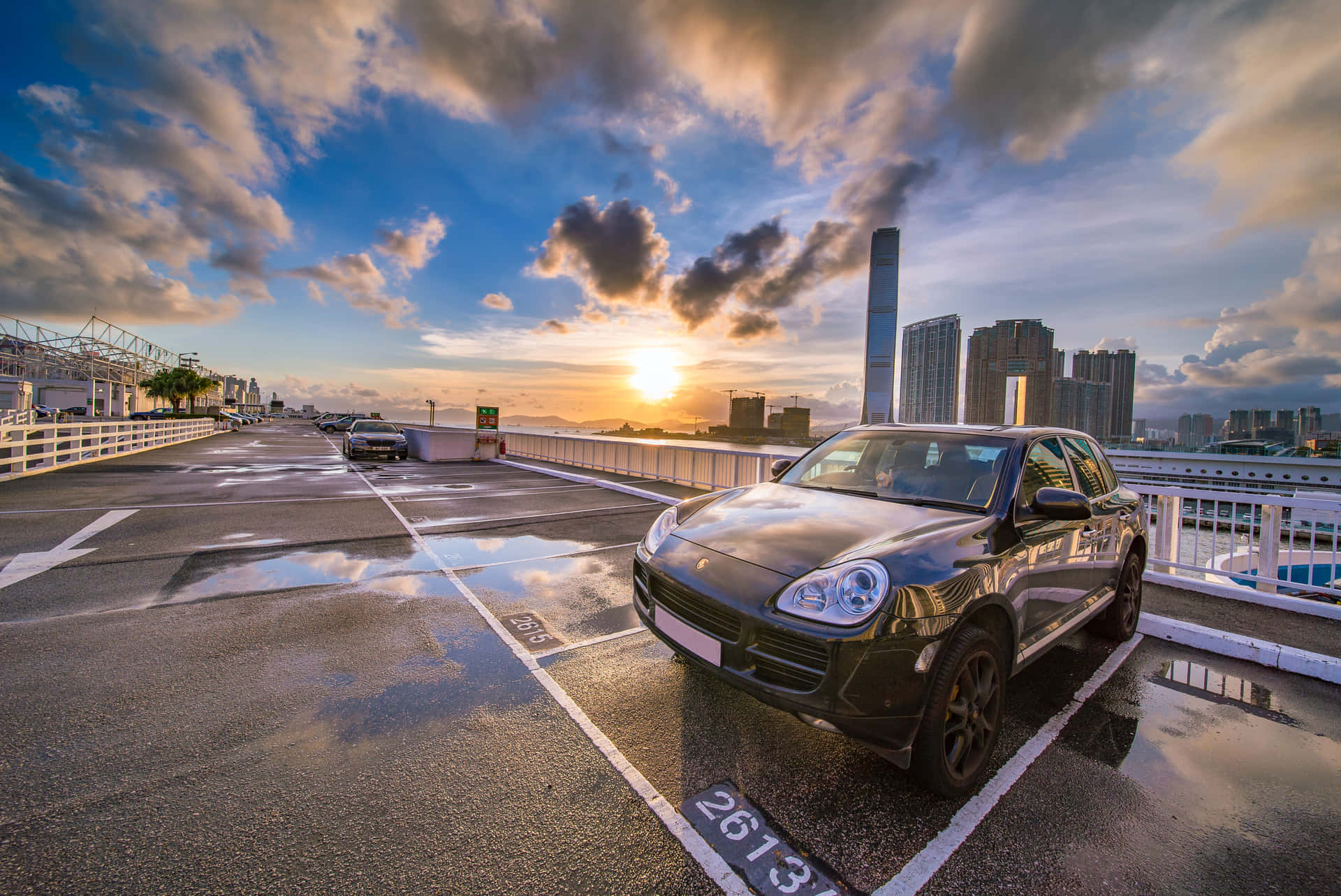 Porsche Supercar Rooftop Parking Lot Wallpaper