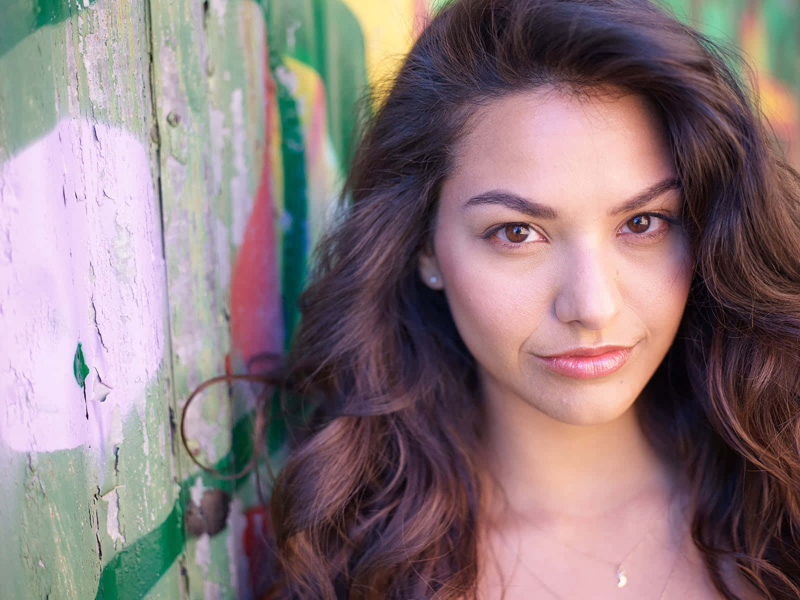 Portraitof Young Woman Against Colorful Background Wallpaper