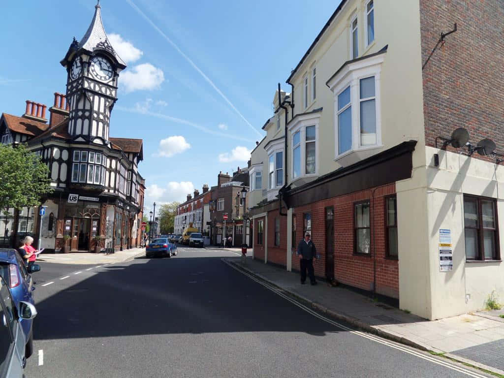 Portsmouth Street Scenewith Historic Clock Tower Wallpaper