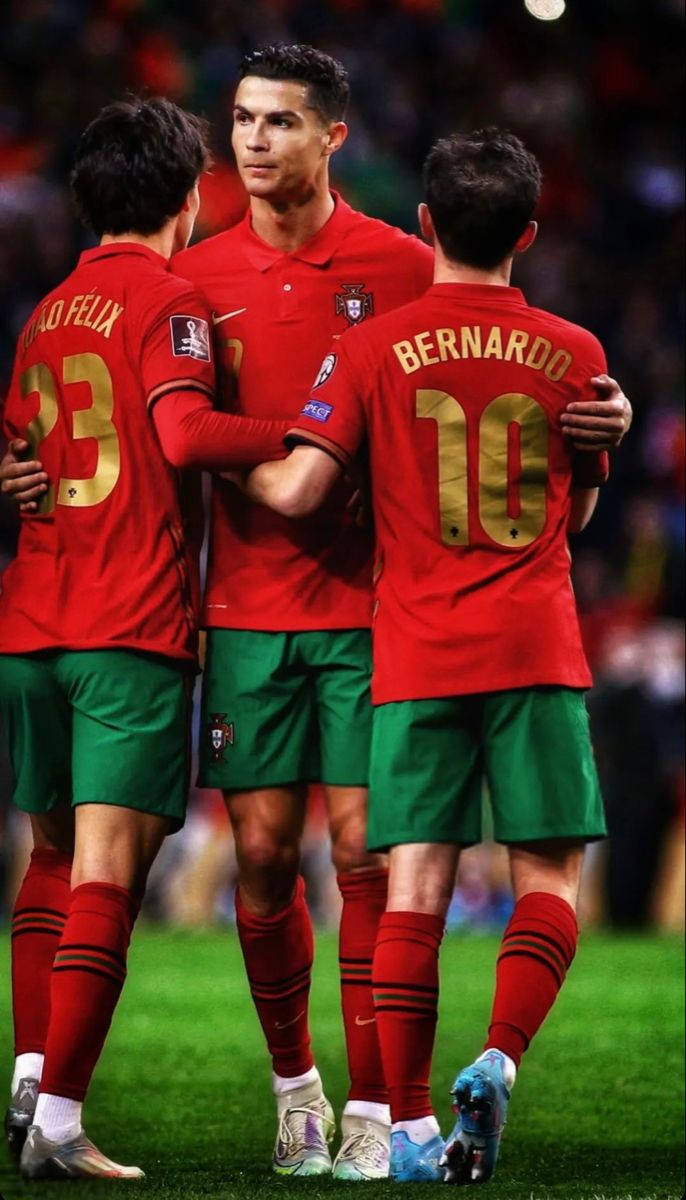 Portugal National Football Team Cr7 Hugging Co-players Background