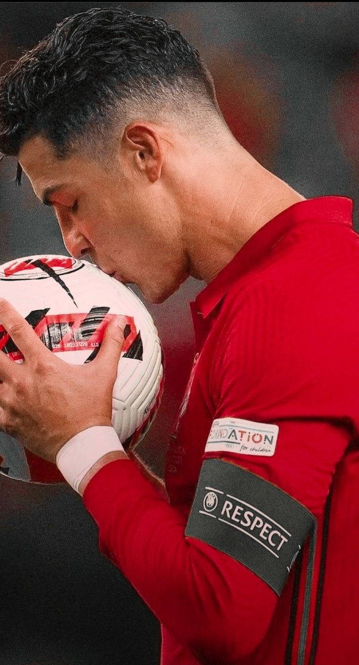 Portugal National Football Team Cristiano Kissing A Ball Wallpaper