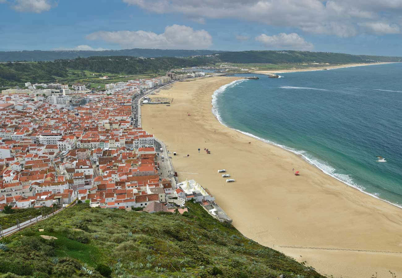 Serene View of the Stunning Portuguese Beach Wallpaper