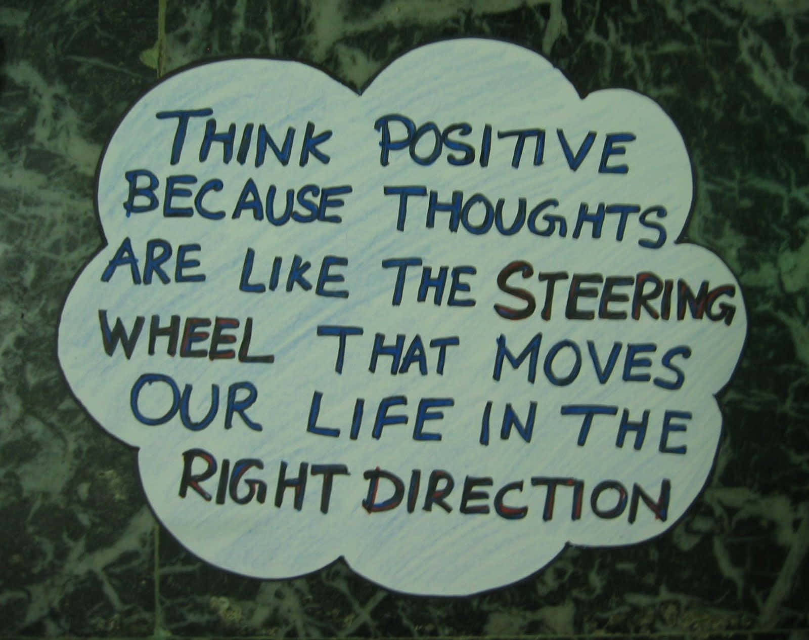 A Sign That Says Think Positive Because Thoughts Are Like The Steering Wheel Of Your Life Moving In The Right Direction