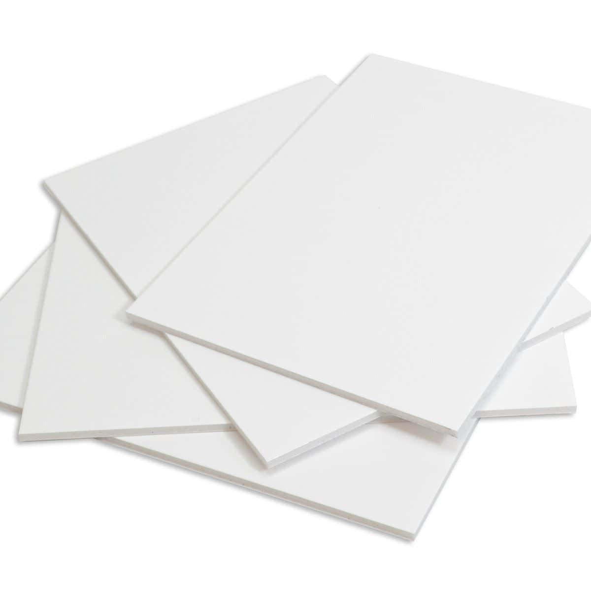 A Stack Of White Paper On A White Surface