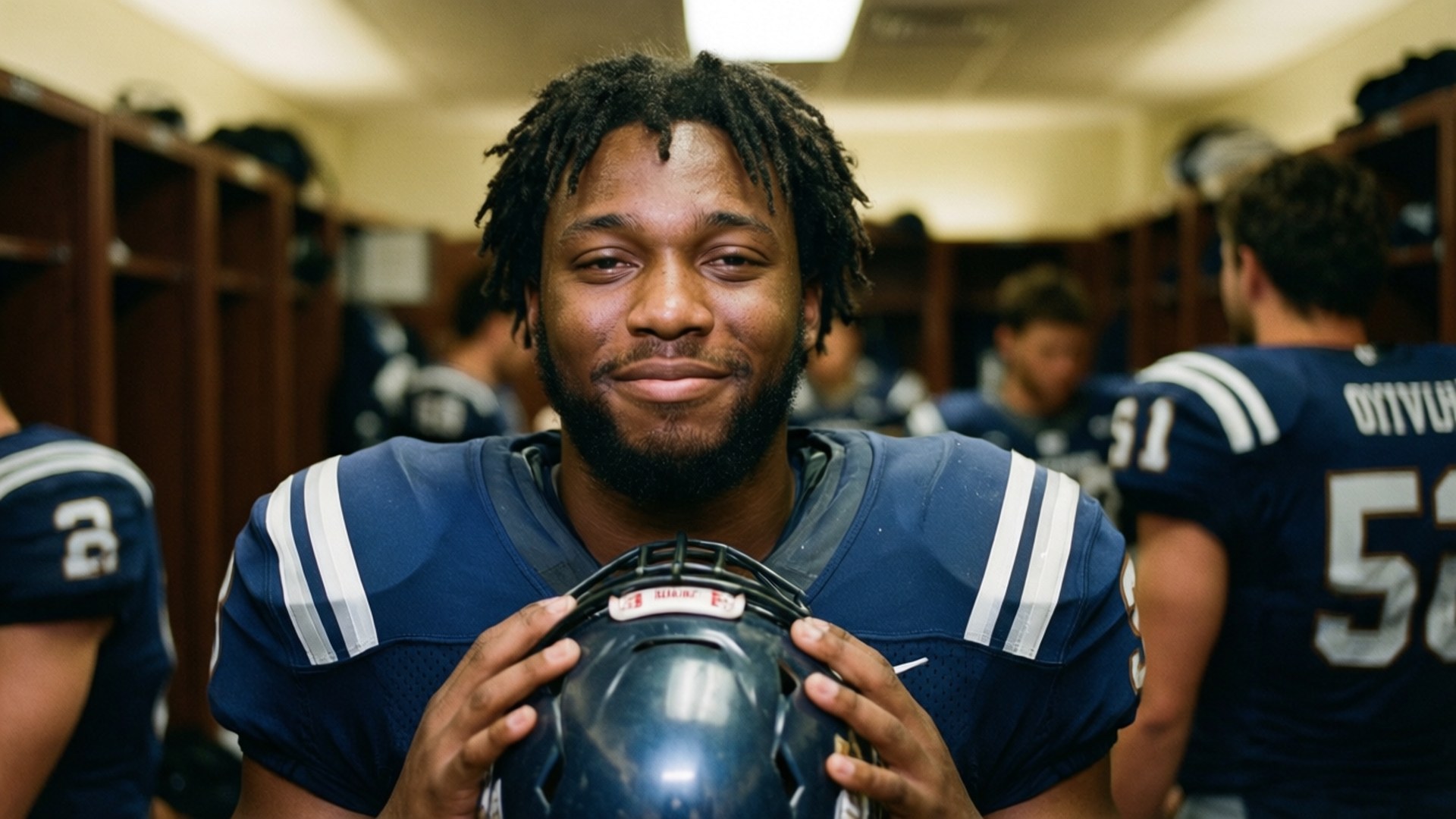 Courtland Sutton in the locker room, smiling with helmet in hand after a hard-fought game. — Courtland Sutton Picture