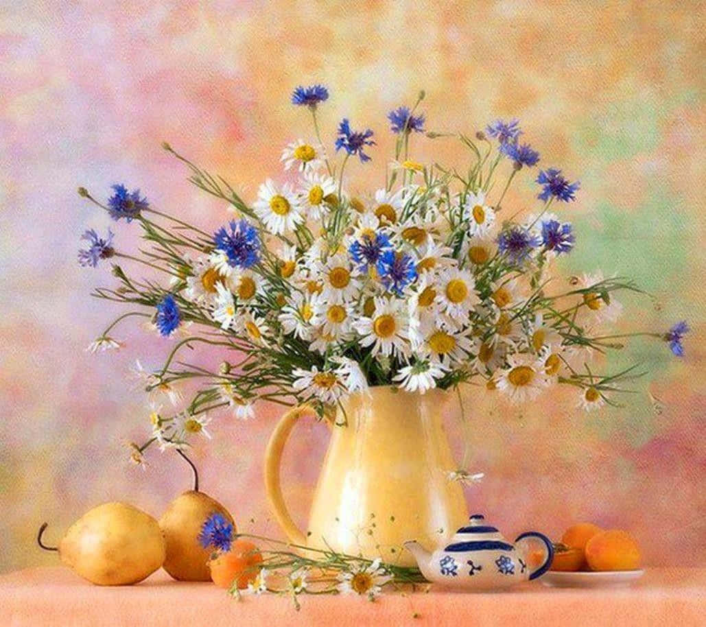 A Vase With Blue And White Daisies And Oranges