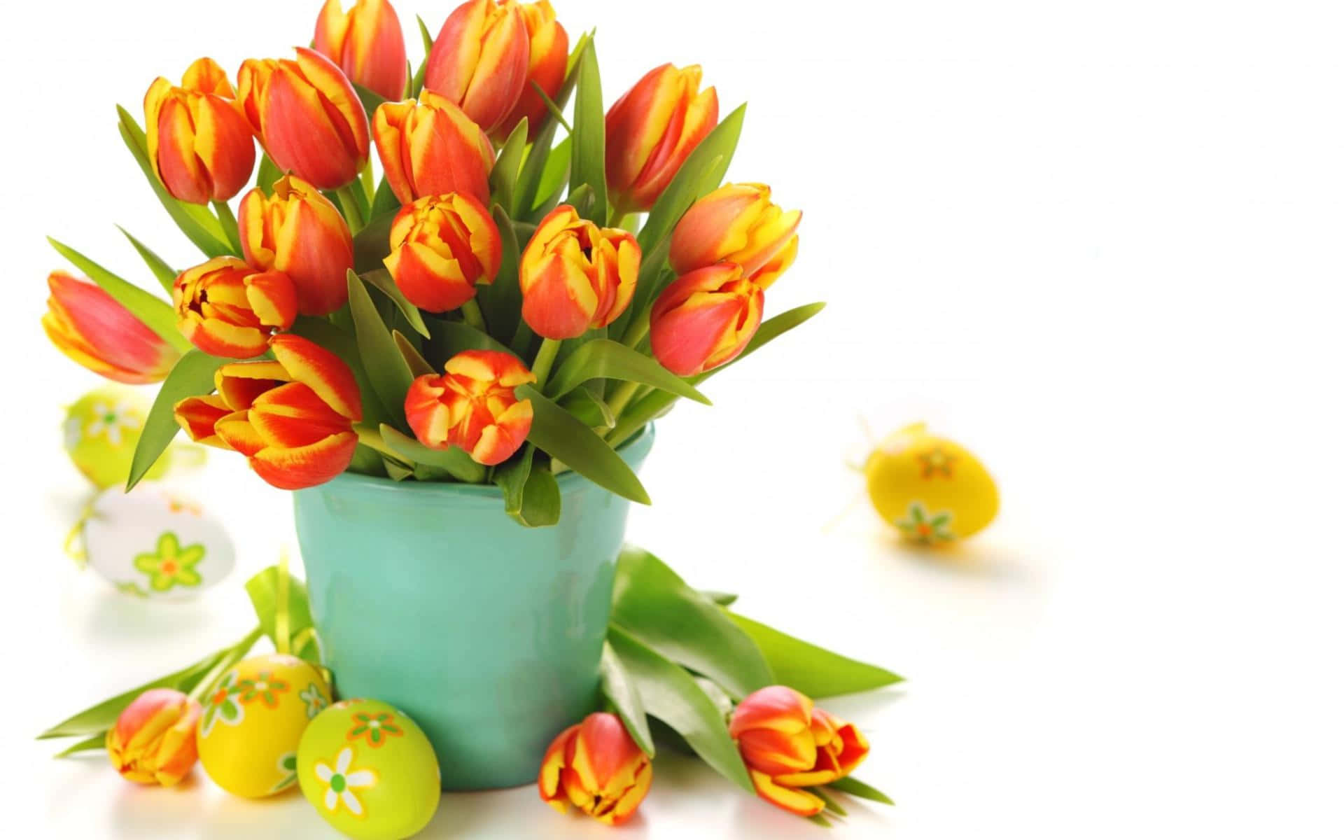 A Vase Of Orange Tulips With Easter Eggs