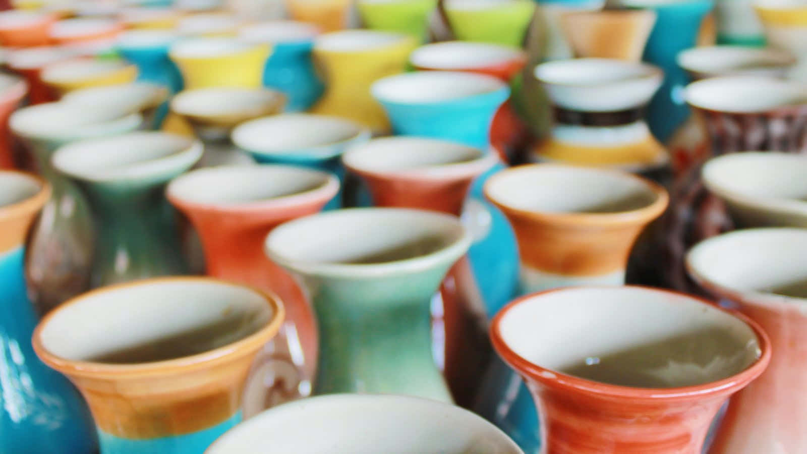 A Bunch Of Colorful Vases