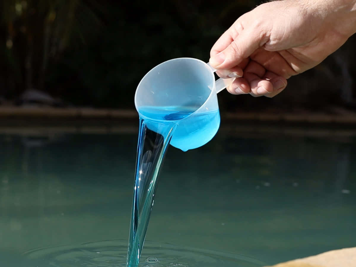 Pouring Blue Pool Water Wallpaper