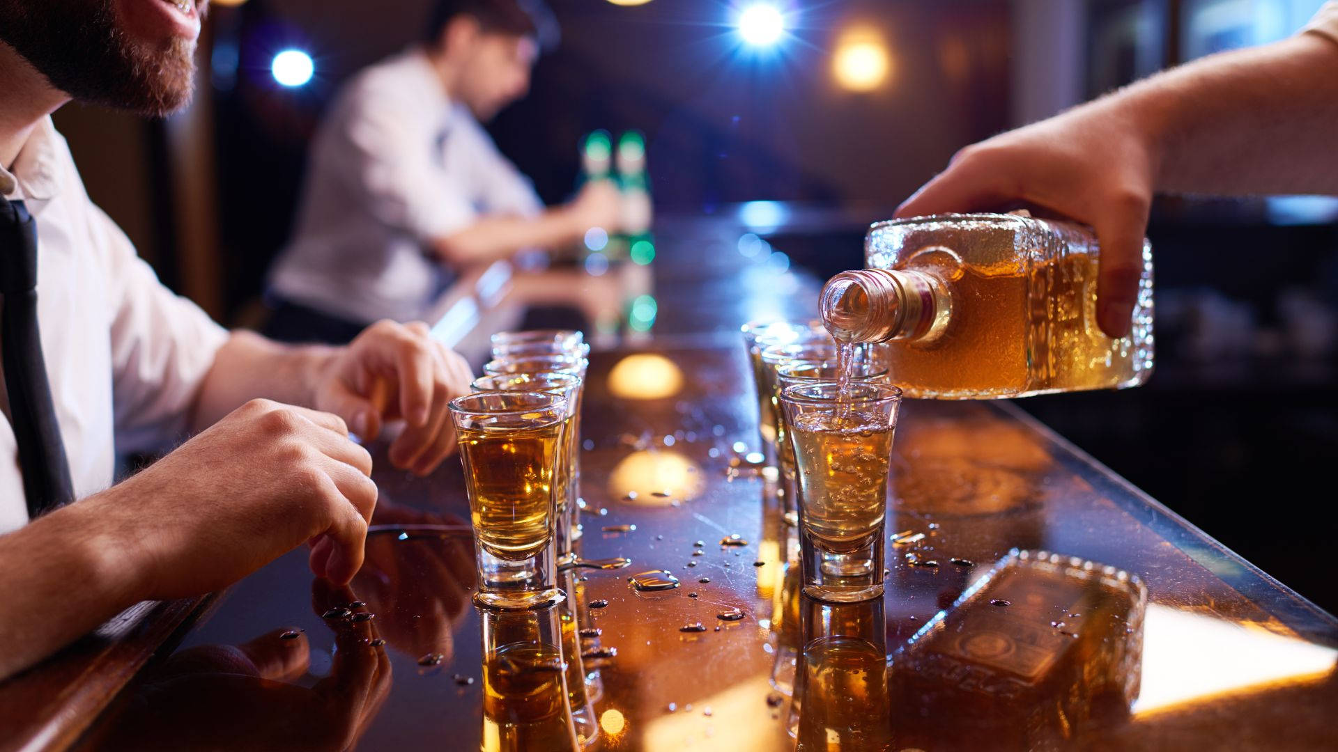 Pouring Glasses Of Alcohol On Bar Counter Picture