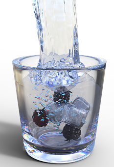 Pouring Water Into Glass With Fruit Ice Cubes PNG