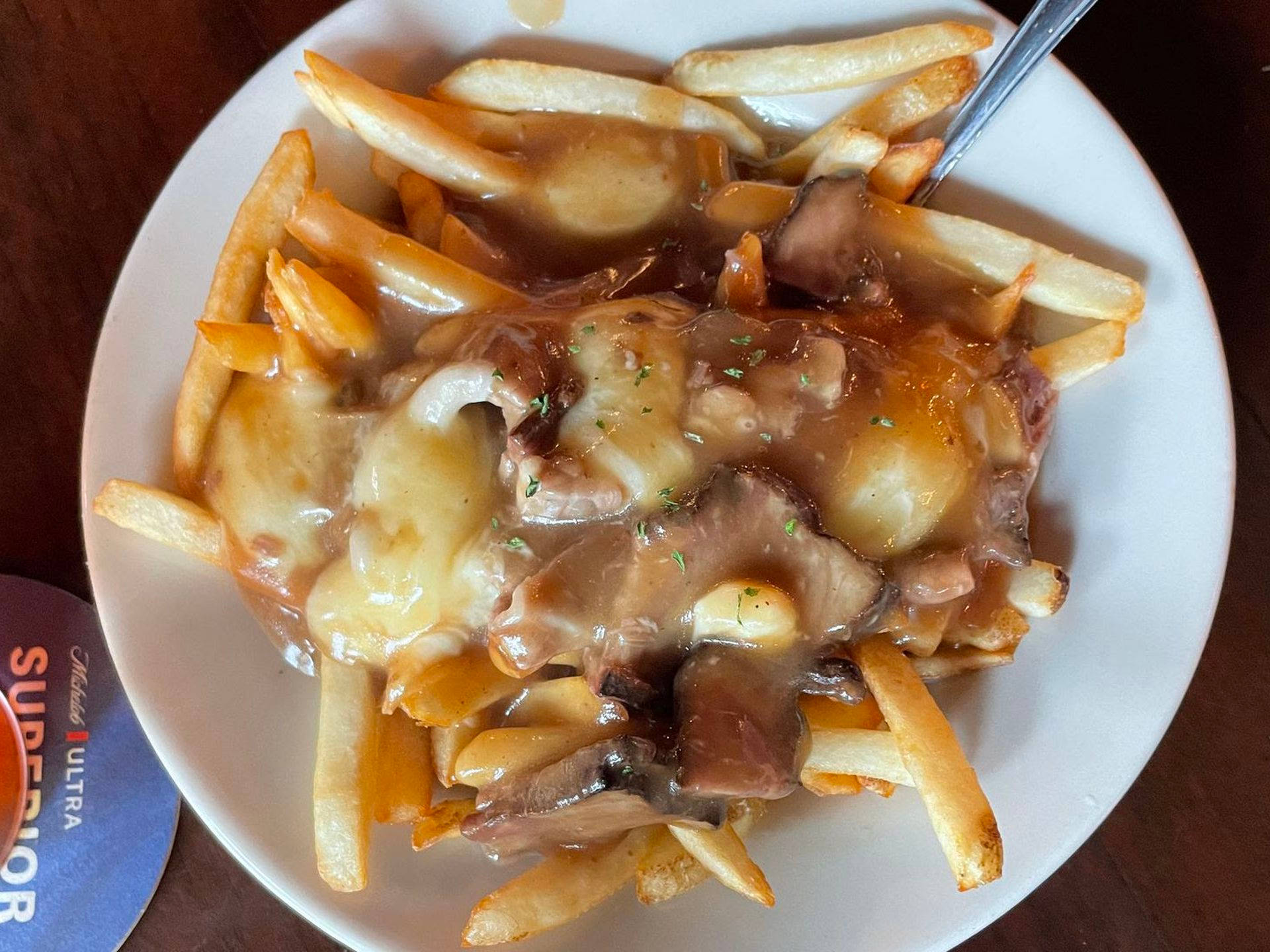 Poutine Drenched In Gravy With Meat Wallpaper