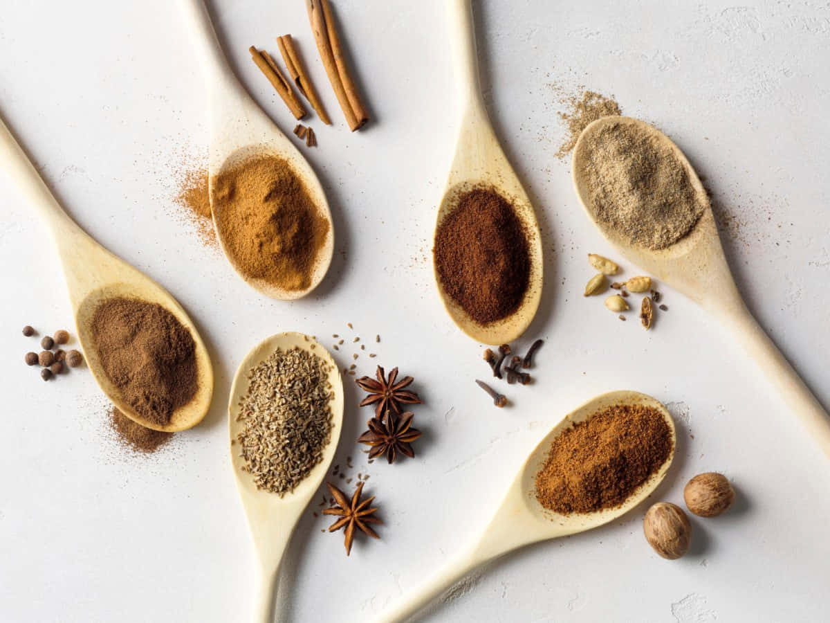 Powdered Spices On Porcelain Spoons Wallpaper