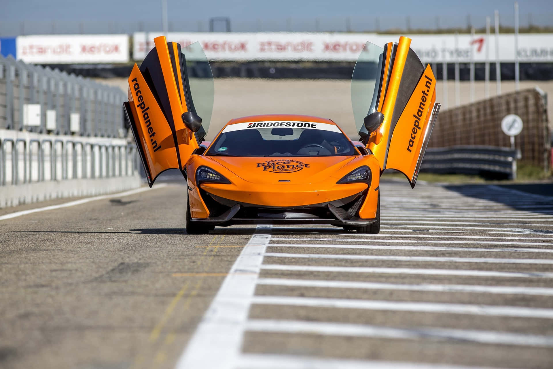 Powerful Beauty - Mclaren 540c In Dynamic Action Wallpaper