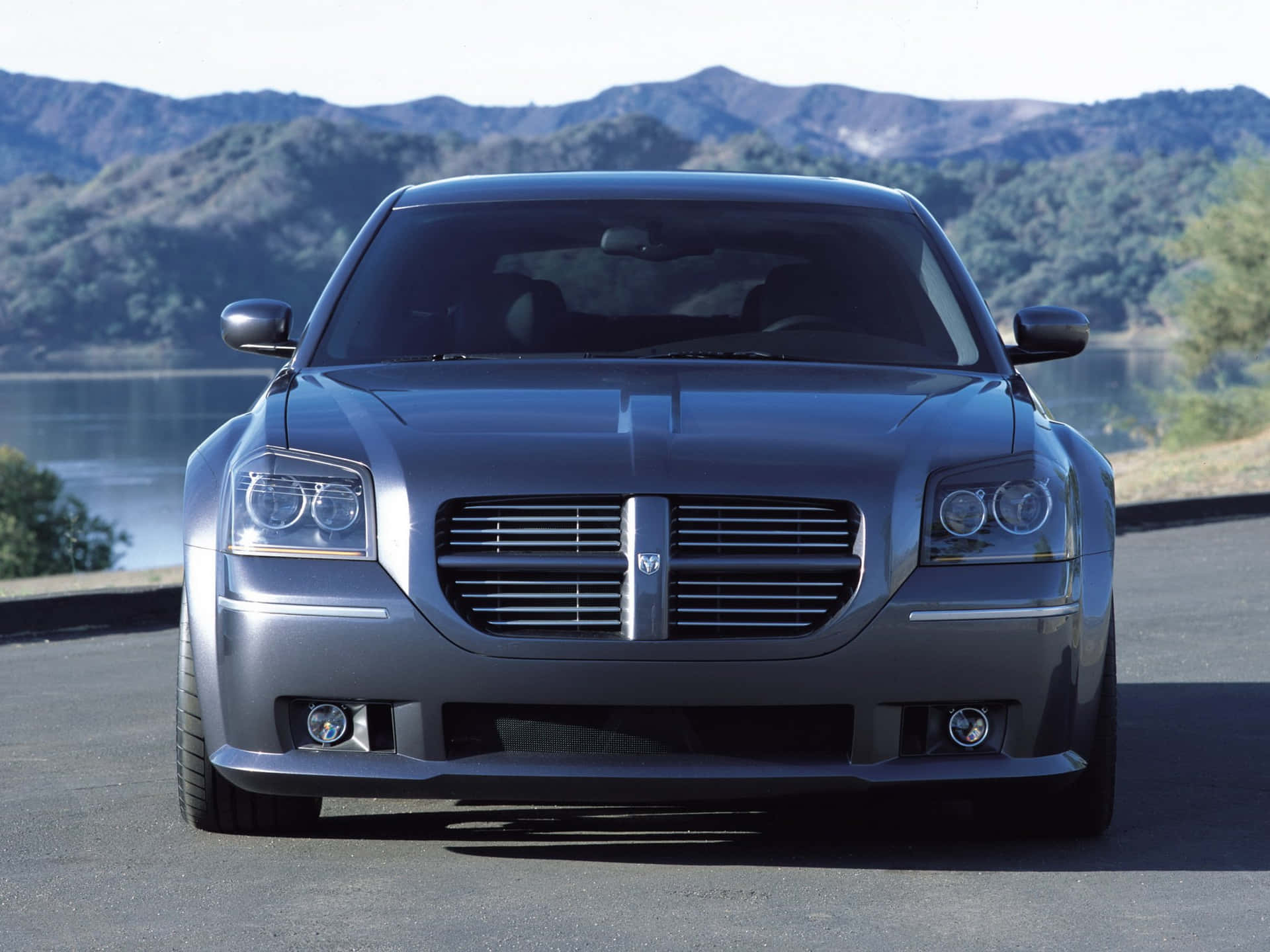 Powerful Dodge Magnum Cruising On A Sun-kissed Highway. Wallpaper