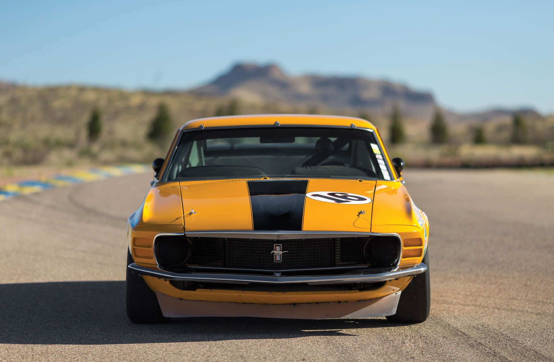 Powerful Ford Mustang Boss 302 In Action Wallpaper