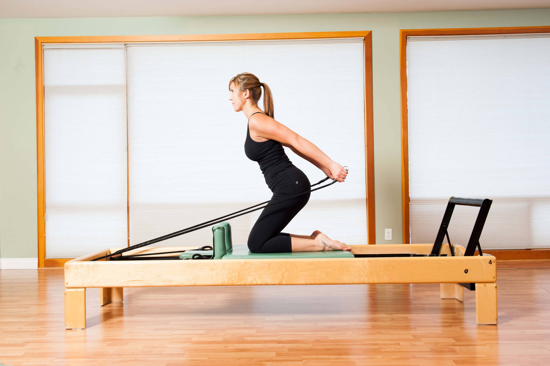 Powerful Lady Practicing Pilates Wallpaper
