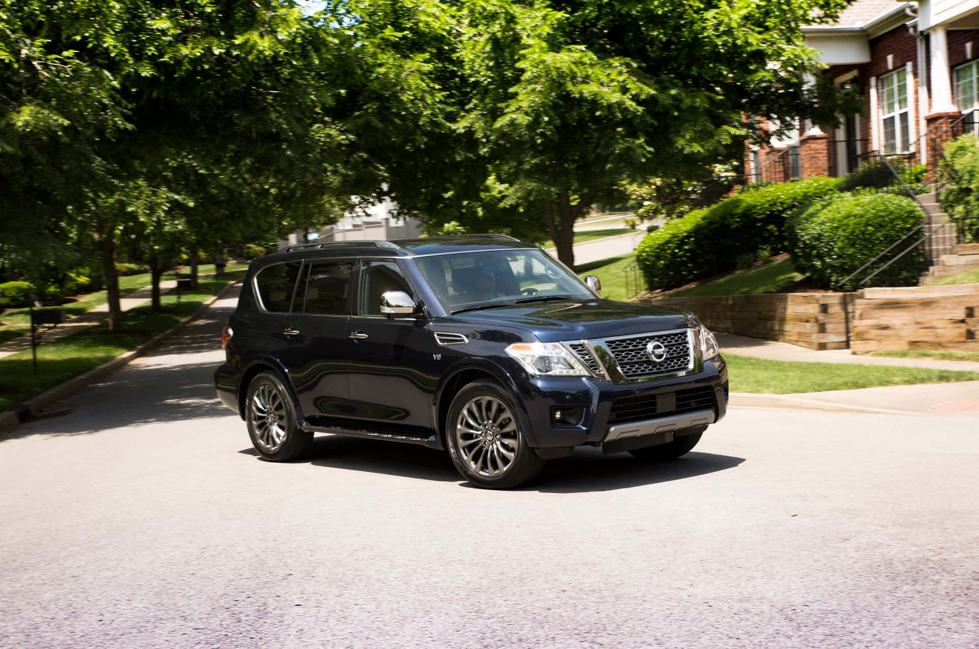 Powerful Nissan Armada Roaring On Open Road Wallpaper