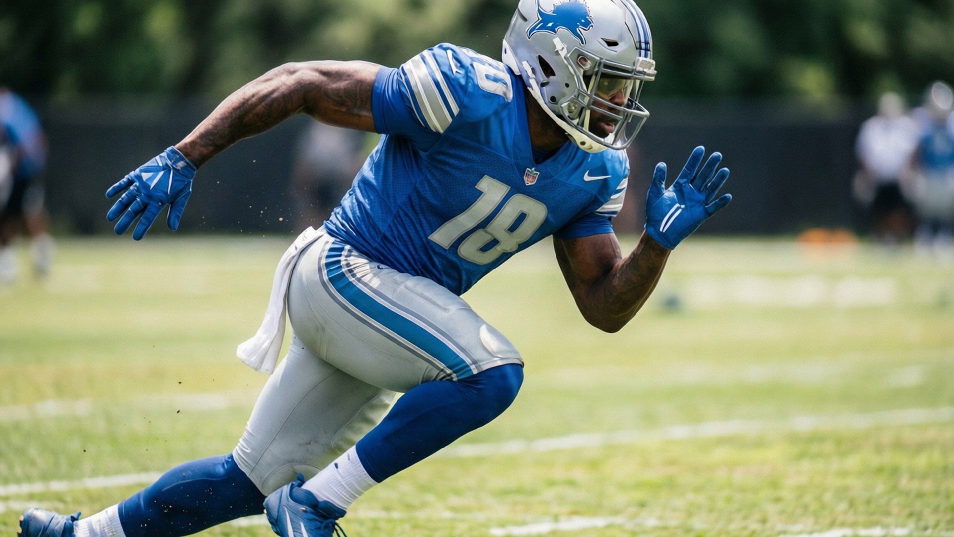 Darius Slay running drills during practice in Lions gear.