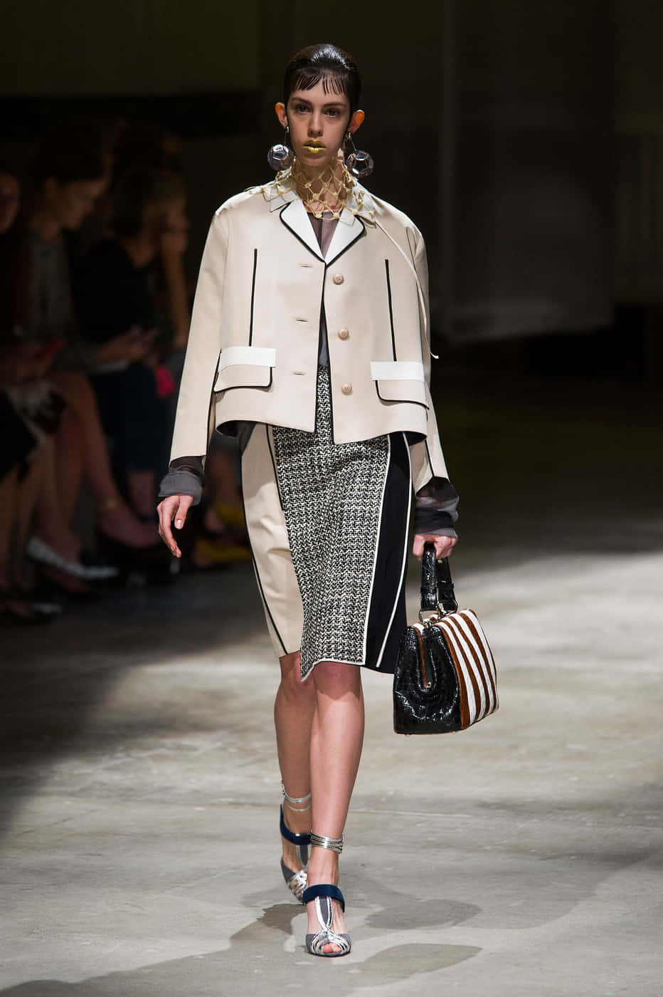 Download A Woman Walks Down The Runway In A Beige Jacket And Skirt ...