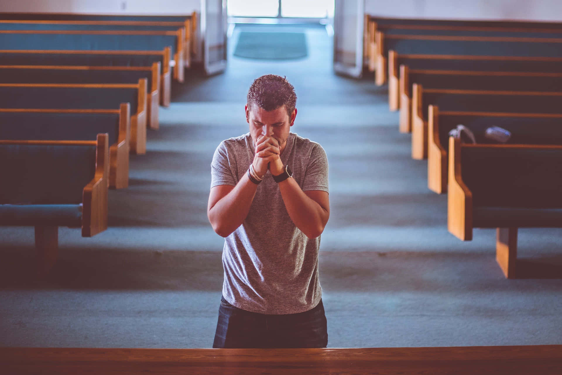 Person praying in a serene environment