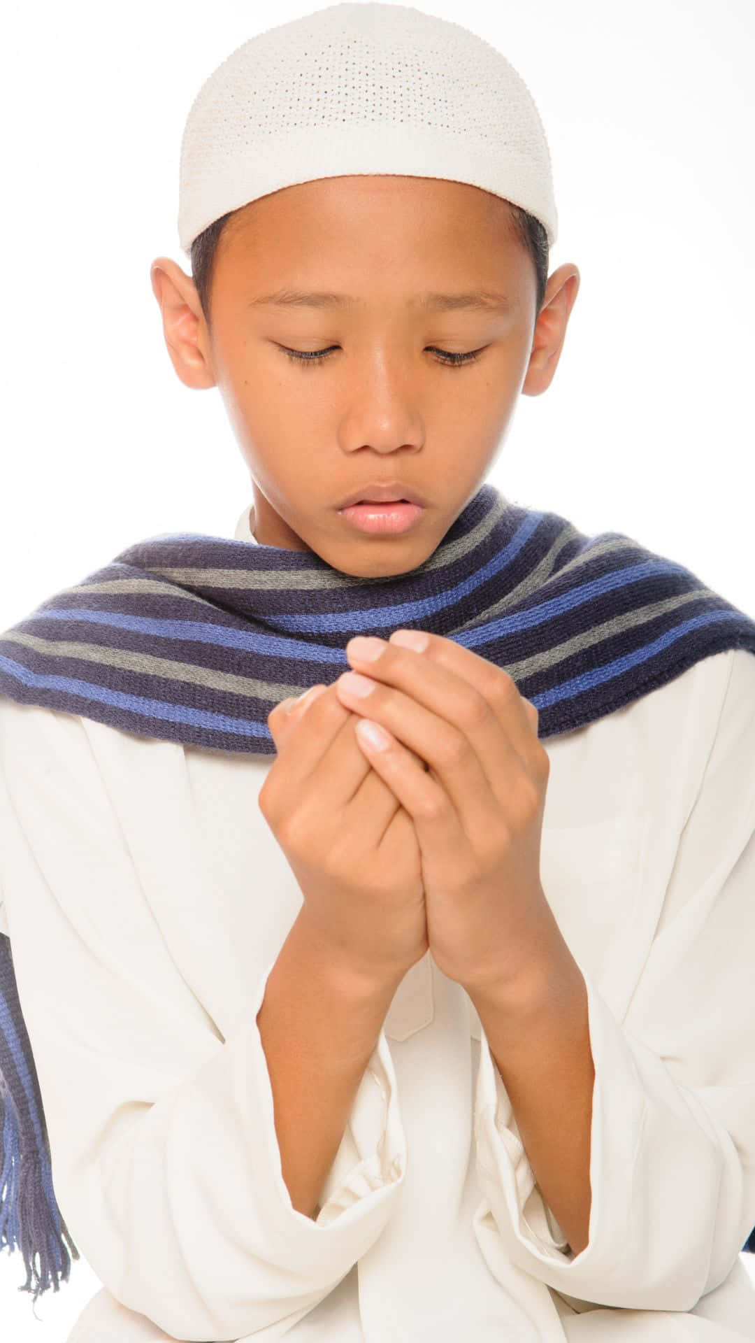 Praying Muslim Boy With Striped Scarf Wallpaper