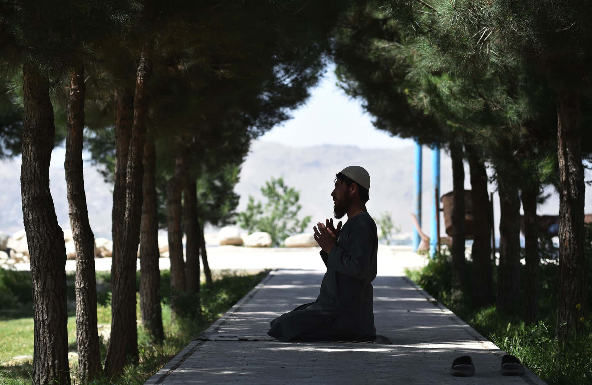 Praying Muslim Boy With Trees Wallpaper