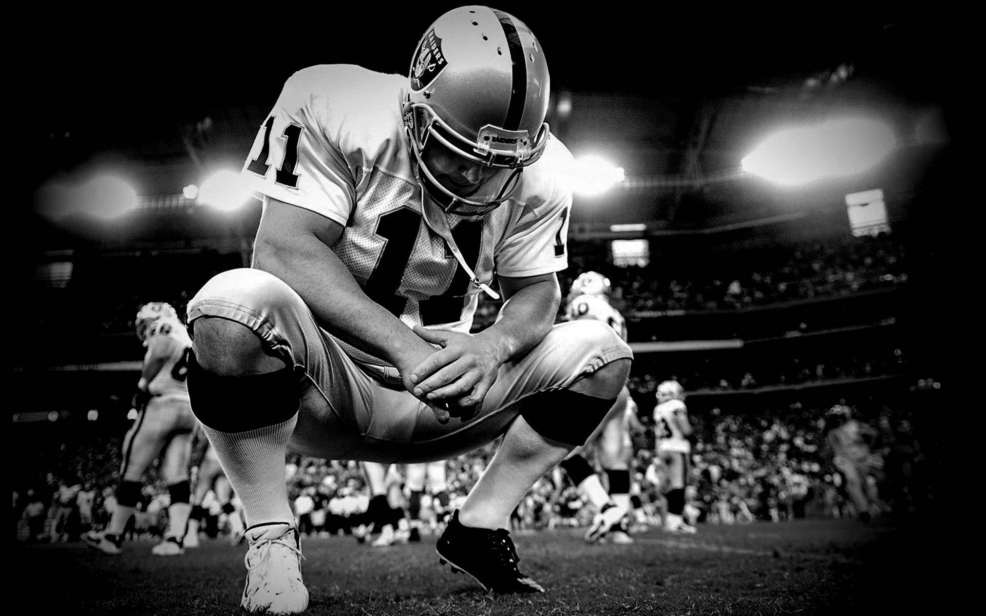 Praying Oakland Raiders Player